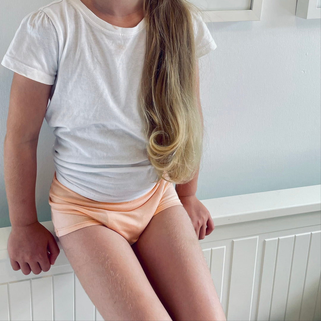 Children wearing Snazzi Pants Night Trainers - Peachy