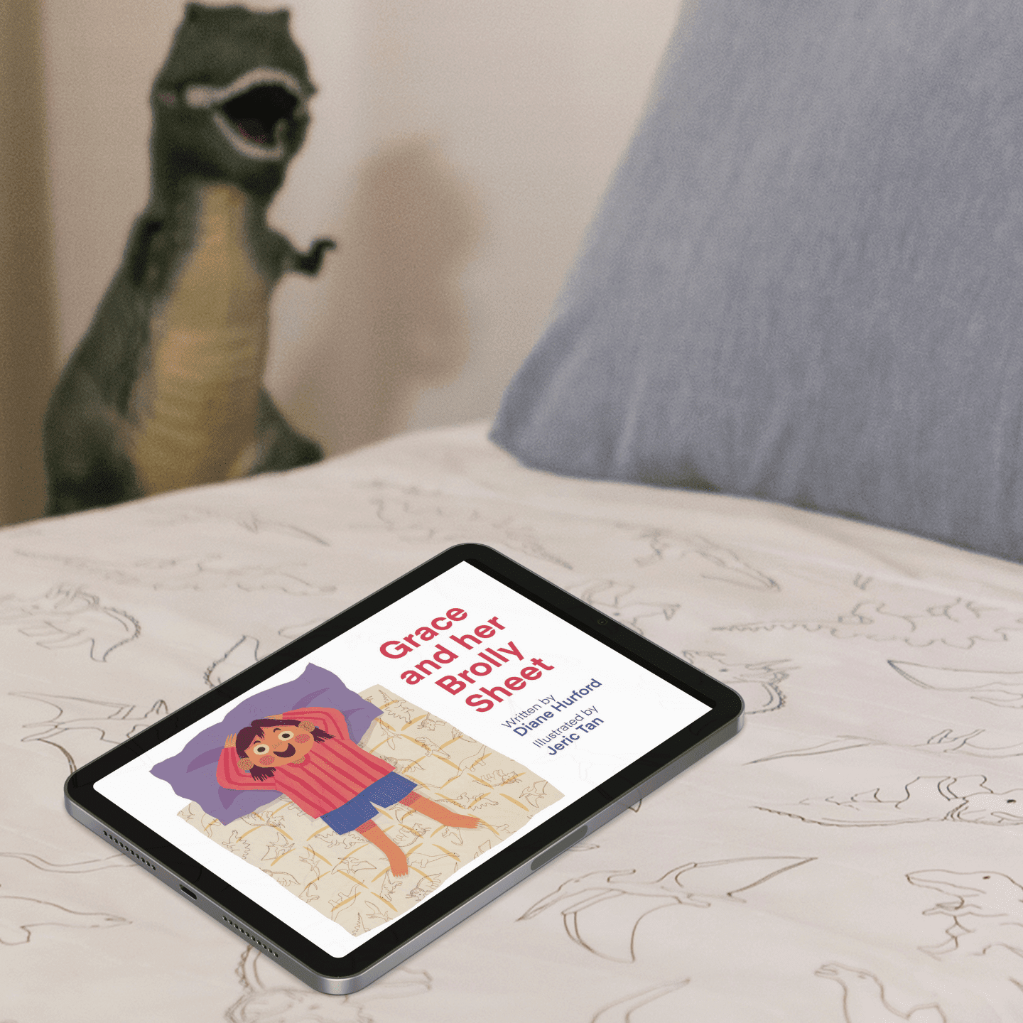 Grace and her Brolly Sheet E-Book on a child's bed