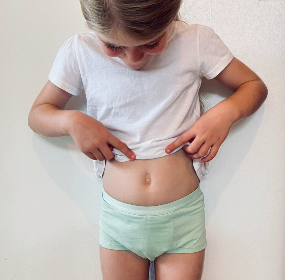 Child wearing Snazzi Pants Night Trainers - Moss Boss