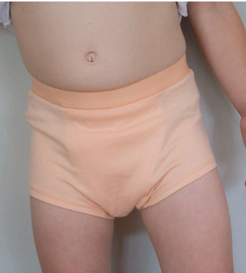 Child wearing Snazzi Pants Night Trainers - Peachy