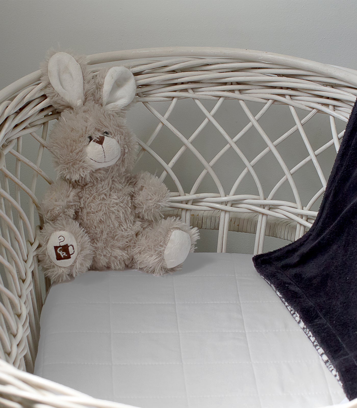 Bassinet Mattress Protector fitted cotton skirt — keeps protector snug on cot mattress