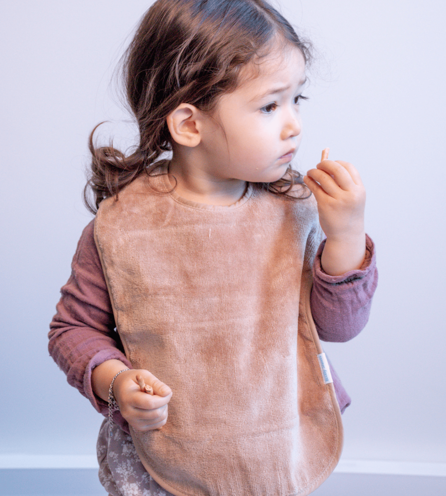 Toddler in our Latte Extra Absorbent Bib